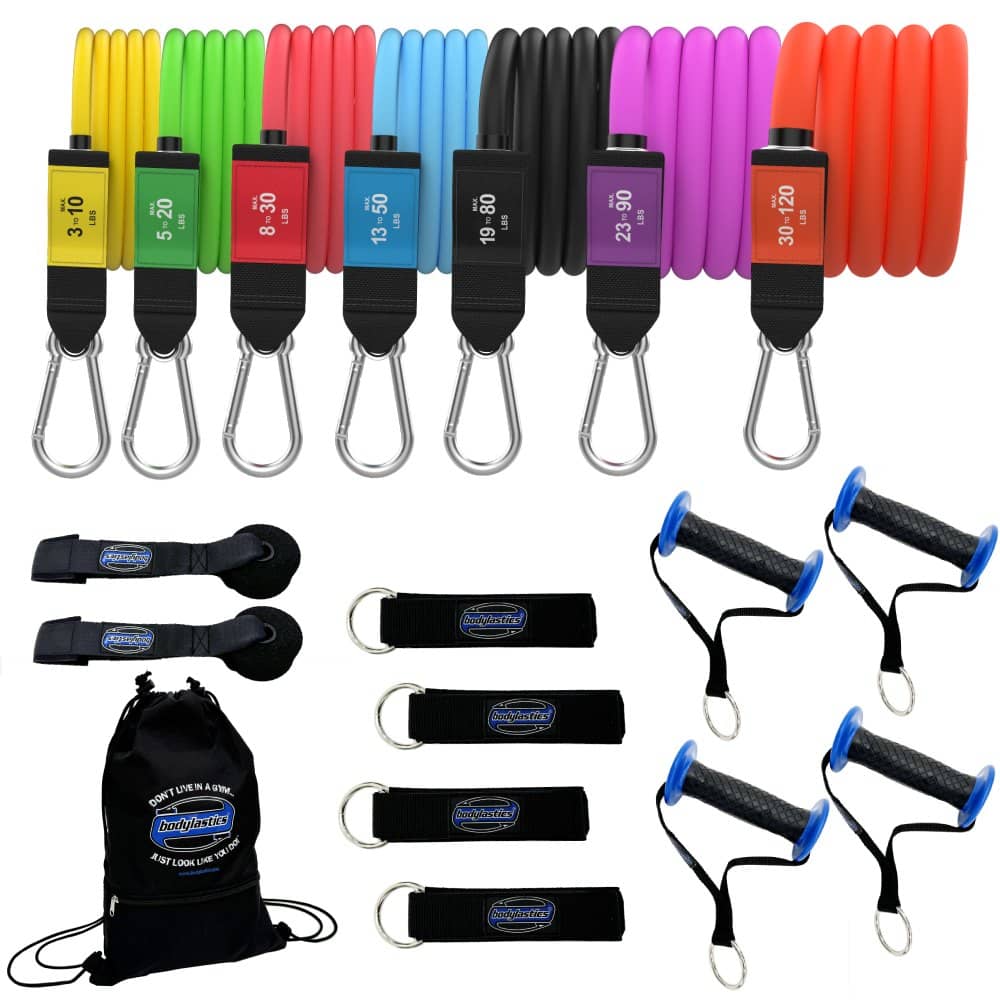 The Bodylastics 7 Band Pro Series Set laid out: seven stackable bands, four handles, four ankle straps, two door anchors and a backpack bag.