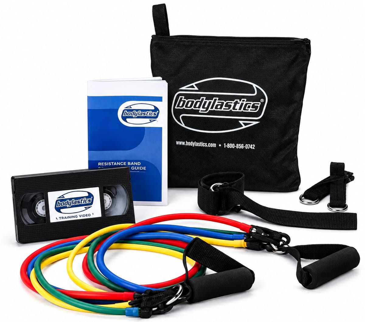An early Bodylastics set: stackable bands in red, yellow, green and blue, handles, ankle straps, a training video, a guide and the Bodylastics bag.