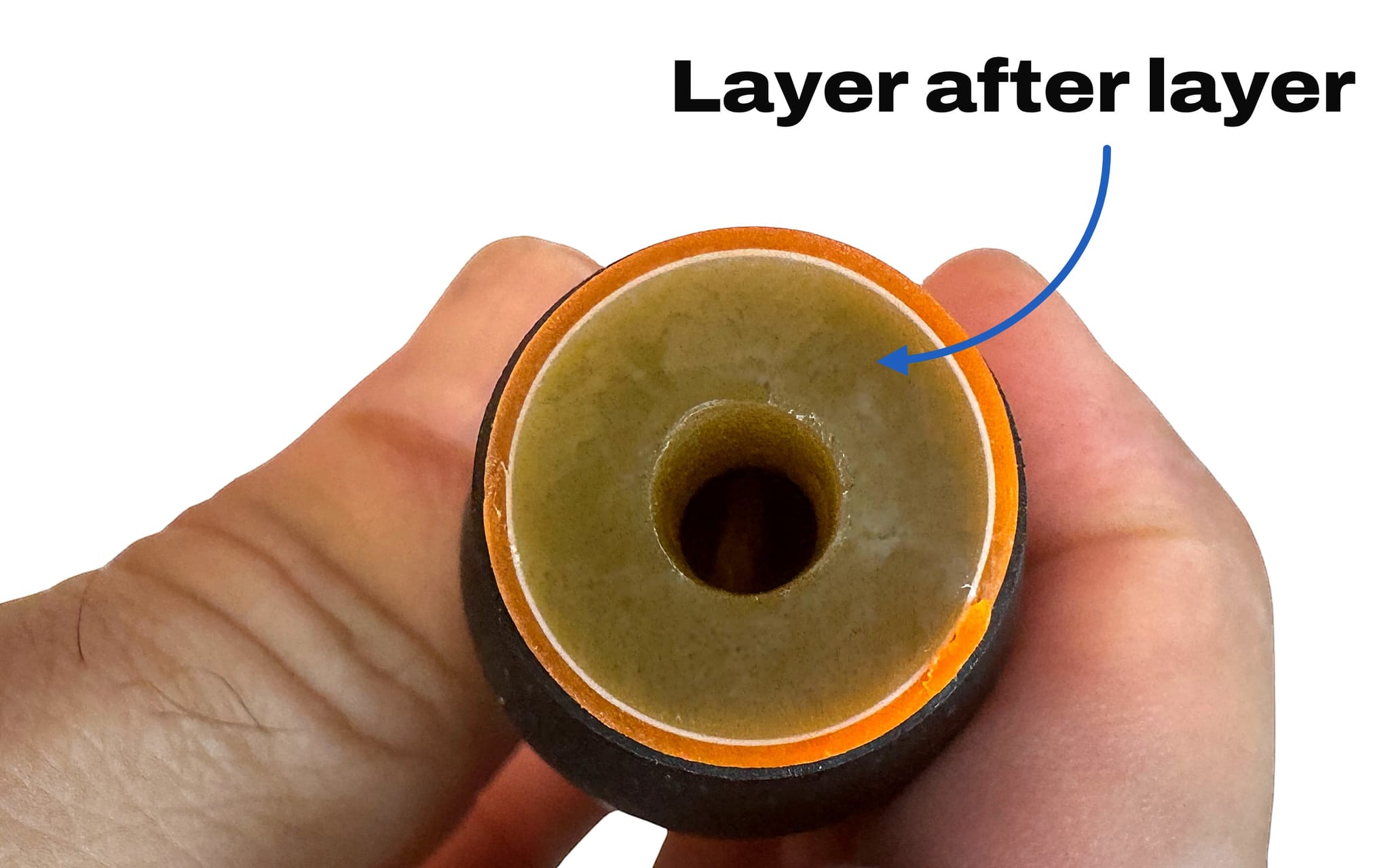 The cut end of a Bodylastics band showing its thick latex wall, built up layer after layer by continuous dipping.